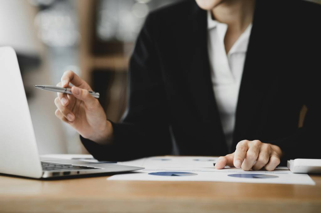 Business woman checking financial documents.