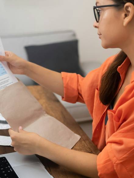 woman confronts utility costs, registering concern at the mounting prices of electricity, water